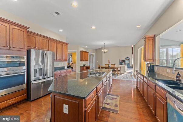 Chandelier, Dining room, Interior, Kitchen, Recessed Lighting, Stainless Steel Appliances, Wood Texture Flooring