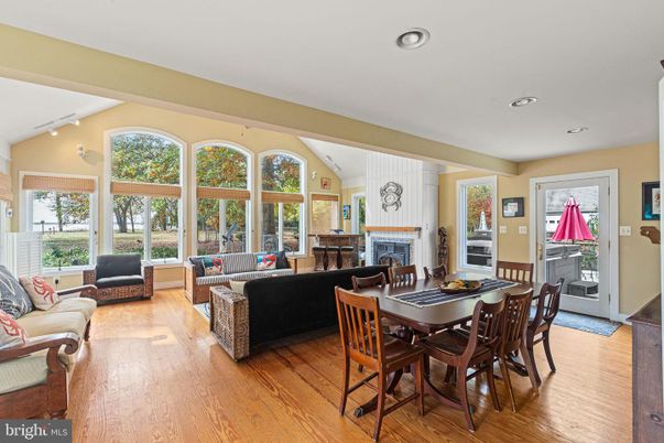 Dining room, Fireplace, Interior, Living room, Recessed Lighting, Wood Texture Flooring