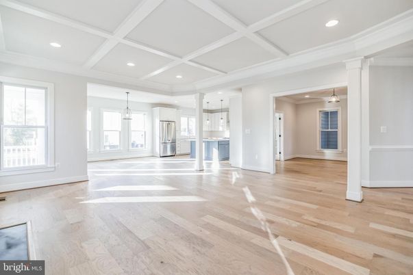 Empty room, Interior, Kitchen, Pendant Lights, Recessed Lighting, Stainless Steel Appliances, Wood Texture Flooring
