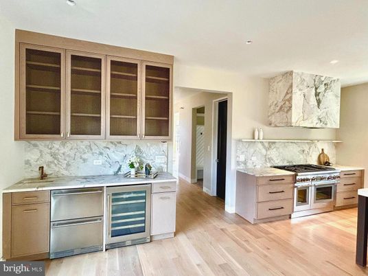 Interior, Kitchen, Marble Walls, Recessed Lighting, Stainless Steel Appliances, Wood Texture Flooring