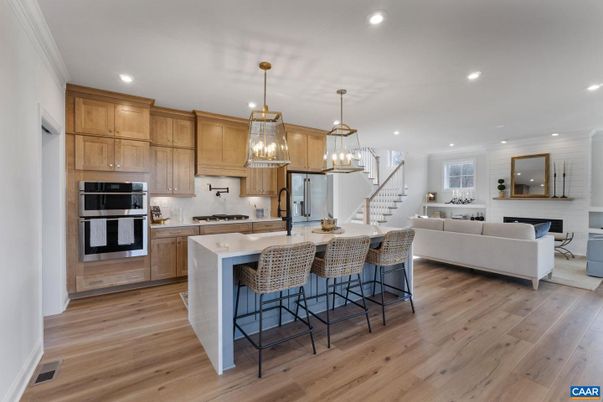 Fireplace, Interior, Kitchen, Living room, Pendant Lights, Recessed Lighting, Stainless Steel Appliances, Wood Texture Flooring