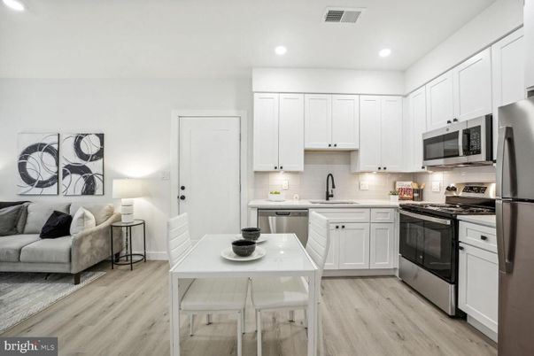 Dining room, Interior, Kitchen, Recessed Lighting, Stainless Steel Appliances, Wood Texture Flooring
