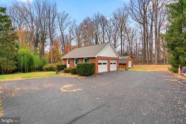 Attached, Backyard, Exterior, Facade, Brick Facade, Cape Cod