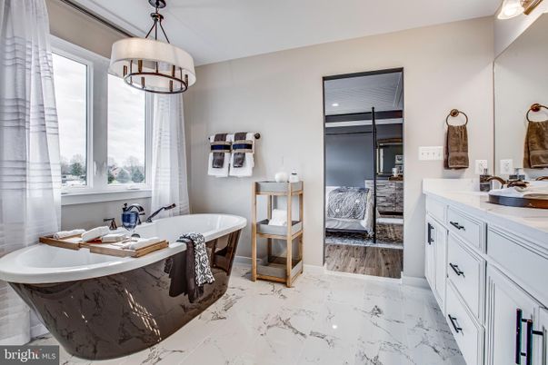 Bathroom, Bedroom, Dual Sink Vanities, Free Standing Baths, Interior, Marble, Pendant Lights, Recessed Lighting, Wood Texture Flooring
