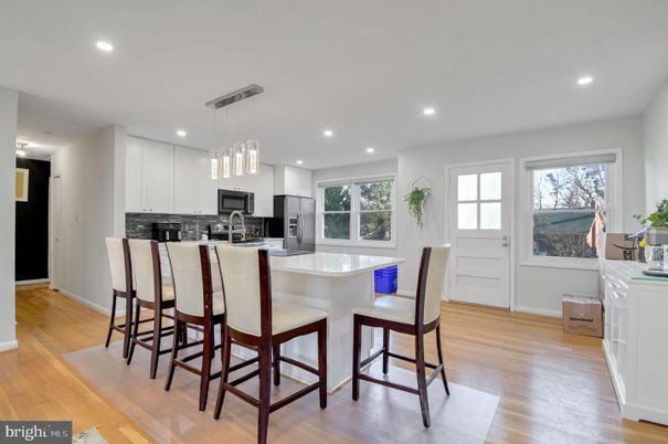 Dining room, Interior, Kitchen, Pendant Lights, Recessed Lighting, Stainless Steel Appliances, Wood Texture Flooring