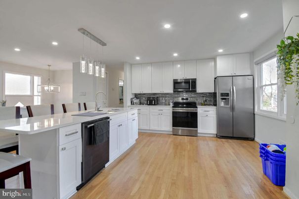 Dining room, Interior, Kitchen, Pendant Lights, Recessed Lighting, Stainless Steel Appliances, Wood Texture Flooring