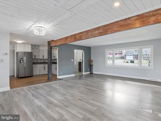 Empty room, Interior, Kitchen, Recessed Lighting, Stainless Steel Appliances, Wood Texture Flooring