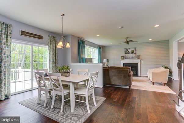 Dining room, Fireplace, Interior, Living room, Pendant Lights, Recessed Lighting, Wood Texture Flooring