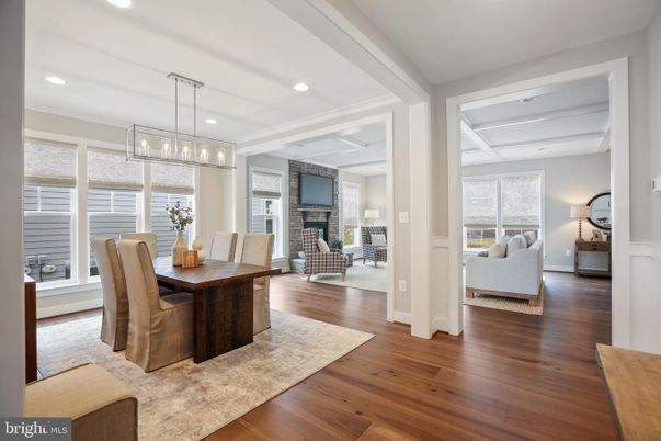Dining room, Fireplace, Interior, Living room, Pendant Lights, Recessed Lighting, Wood Texture Flooring