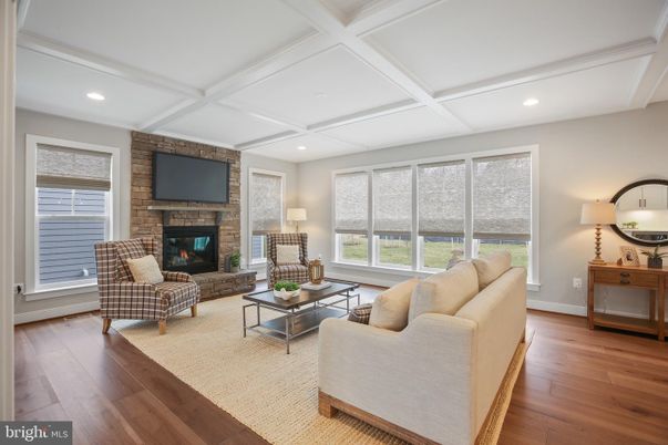 Fireplace, Interior, Living room, Recessed Lighting, Stone Walls, Wood Texture Flooring