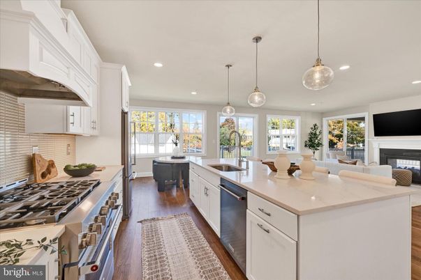 Dining room, Fireplace, Interior, Kitchen, Living room, Pendant Lights, Recessed Lighting, Stainless Steel Appliances, Wood Texture Flooring