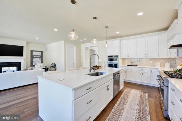 Fireplace, Interior, Kitchen, Living room, Pendant Lights, Recessed Lighting, Stainless Steel Appliances, Wood Texture Flooring