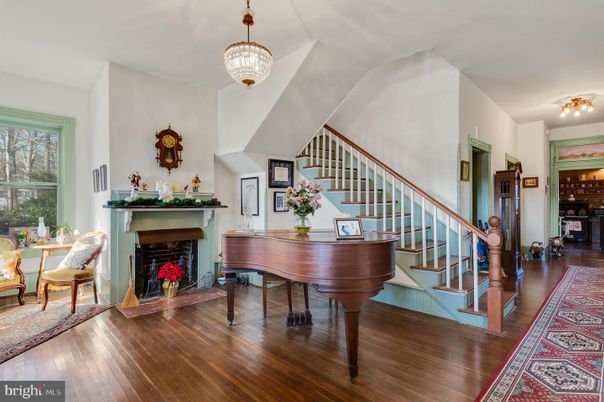 Fireplace, Interior, Pendant Lights, Piano, Wood Texture Flooring