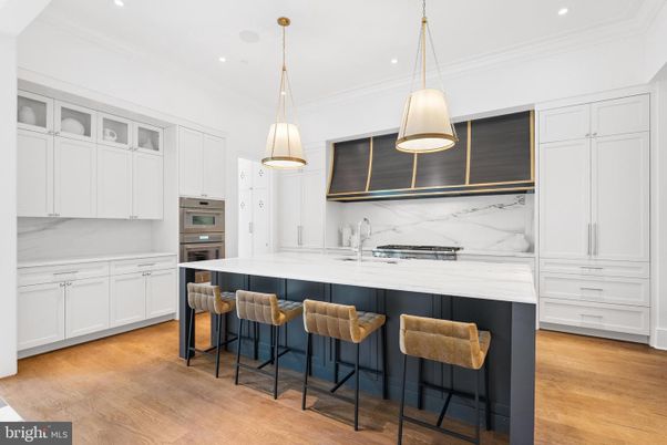 Interior, Kitchen, Marble Walls, Pendant Lights, Recessed Lighting, Stainless Steel Appliances, Wood Texture Flooring