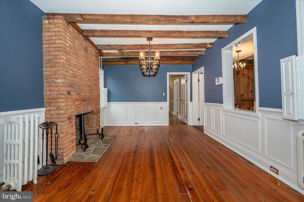 Chandelier, Empty room, Fireplace, Interior, Stone Walls, Wooden Beams, Wood Texture Flooring