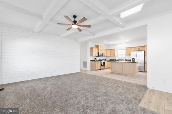 Empty room, Interior, Kitchen, Recessed Lighting, Stainless Steel Appliances, Wood Texture Flooring