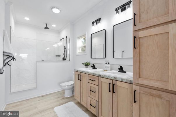 Bathroom, Dual Sink Vanities, Glass Shower, Interior, Recessed Lighting, Wood Texture Flooring