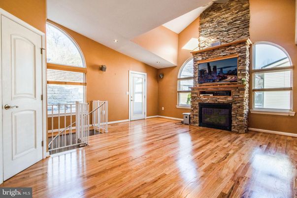 Fireplace, Interior, Recessed Lighting, Stone Walls, Wood Texture Flooring