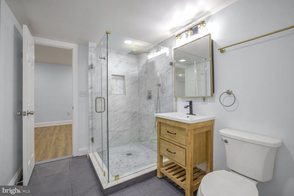 Bathroom, Glass Shower, Interior, Marble Walls, Recessed Lighting, Wood Texture Flooring