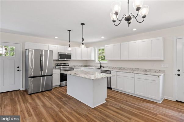 Chandelier, Interior, Kitchen, Pendant Lights, Recessed Lighting, Stainless Steel Appliances, Wood Texture Flooring