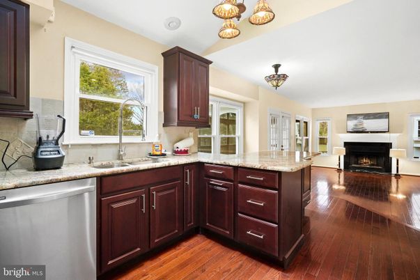 Fireplace, Interior, Kitchen, Stainless Steel Appliances, Wood Texture Flooring