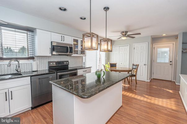 Dining room, Interior, Kitchen, Pendant Lights, Recessed Lighting, Stainless Steel Appliances, Wood Texture Flooring