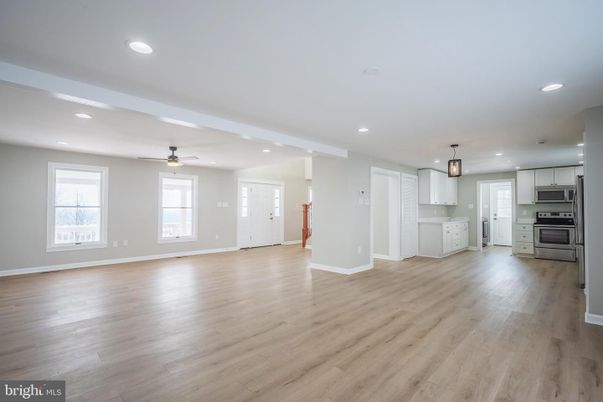 Empty room, Interior, Kitchen, Pendant Lights, Recessed Lighting, Stainless Steel Appliances, Wood Texture Flooring