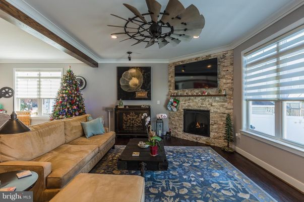 Fireplace, Interior, Living room, Recessed Lighting, Stone Walls, Wood Texture Flooring
