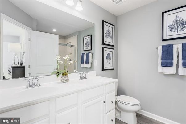 Bathroom, Dual Sink Vanities, Interior, Recessed Lighting, Wood Texture Flooring