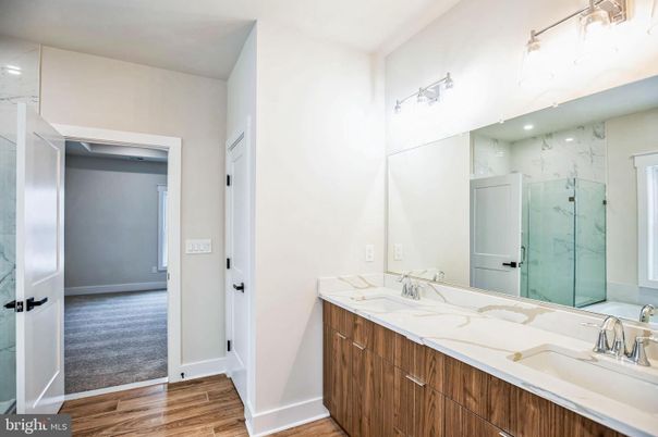 Bathroom, Dual Sink Vanities, Interior, Marble Walls, Wood Texture Flooring