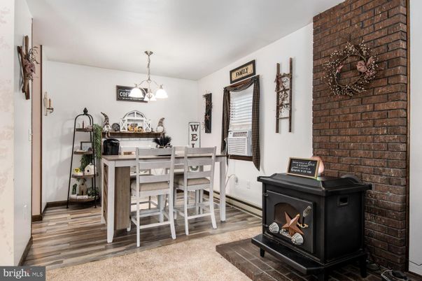 Dining room, Fireplace, Interior, Pendant Lights, Stone Walls, Wood Texture Flooring