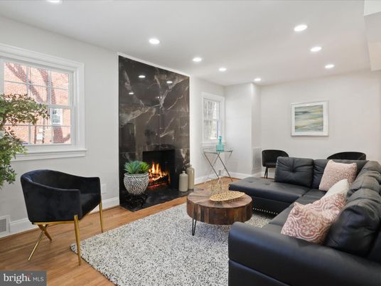 Fireplace, Interior, Living room, Marble Walls, Recessed Lighting, Wood Texture Flooring