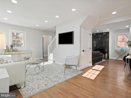 Fireplace, Interior, Living room, Marble Walls, Recessed Lighting, Wood Texture Flooring