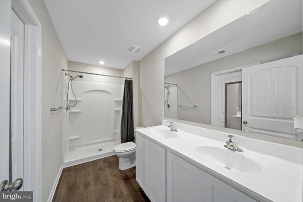Bathroom, Dual Sink Vanities, Interior, Recessed Lighting, Wood Texture Flooring