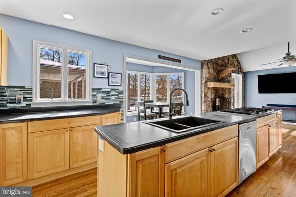 Dining room, Fireplace, Interior, Kitchen, Recessed Lighting, Wood Texture Flooring