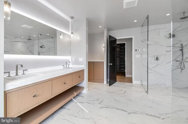 Bathroom, Dual Sink Vanities, Glass Shower, Interior, Marble, Marble Walls, Pendant Lights, Recessed Lighting