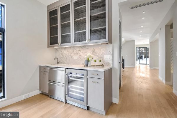 Interior, Kitchen, Marble Walls, Recessed Lighting, Stainless Steel Appliances, Wood Texture Flooring