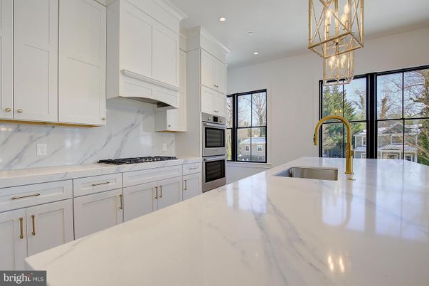 Interior, Kitchen, Marble Walls, Pendant Lights, Recessed Lighting, Stainless Steel Appliances