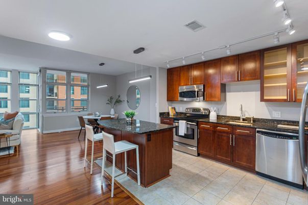 Dining room, Interior, Kitchen, Pendant Lights, Recessed Lighting, Stainless Steel Appliances, Wood Texture Flooring