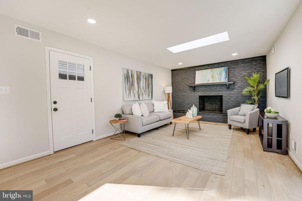 Fireplace, Interior, Living room, Recessed Lighting, Stone Walls, Wood Texture Flooring