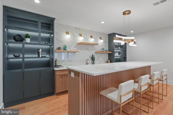 Interior, Kitchen, Marble Walls, Pendant Lights, Recessed Lighting, Stainless Steel Appliances, Wood Texture Flooring