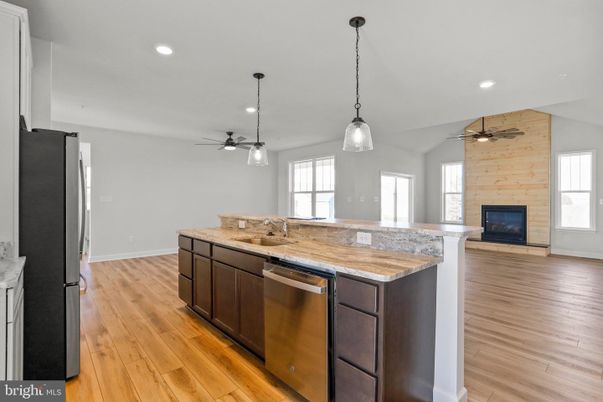 Fireplace, Interior, Kitchen, Pendant Lights, Recessed Lighting, Stone Walls, Wood Texture Flooring