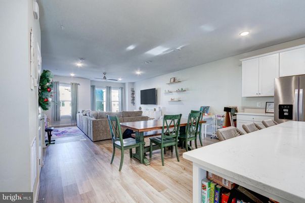 Dining room, Interior, Kitchen, Living room, Recessed Lighting, Stainless Steel Appliances, Wood Texture Flooring