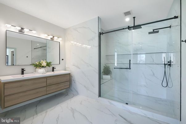 Bathroom, Dual Sink Vanities, Glass Shower, Interior, Marble, Marble Walls, Recessed Lighting
