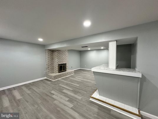 Fireplace, Interior, Recessed Lighting, Stone Walls, Wood Texture Flooring