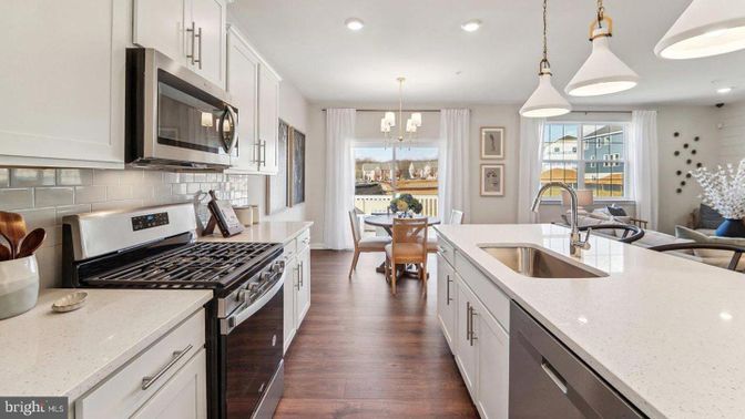 Chandelier, Dining room, Interior, Kitchen, Pendant Lights, Recessed Lighting, Stainless Steel Appliances, Wood Texture Flooring