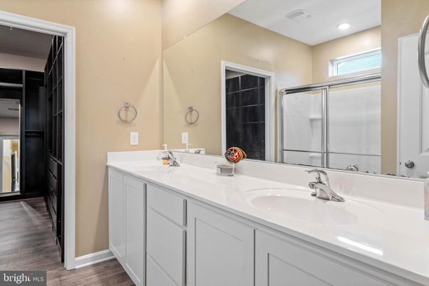Bathroom, Dual Sink Vanities, Interior, Recessed Lighting, Wood Texture Flooring