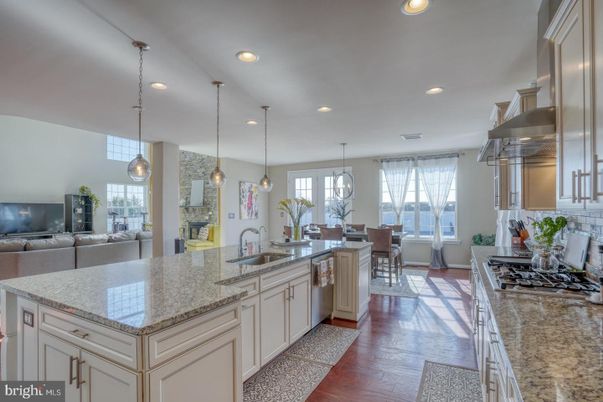 Dining room, Interior, Kitchen, Living room, Pendant Lights, Recessed Lighting, Stainless Steel Appliances, Wood Texture Flooring