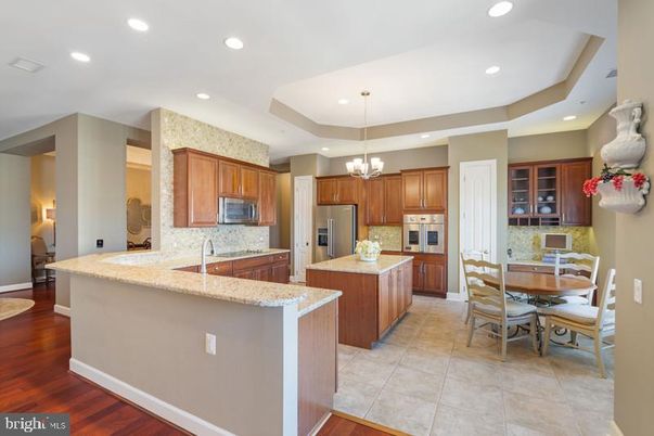 Chandelier, Dining room, Interior, Kitchen, Recessed Lighting, Stainless Steel Appliances, Wood Texture Flooring