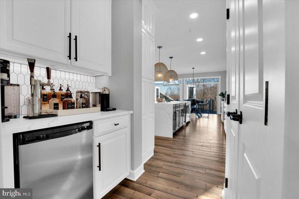 Dining room, Interior, Kitchen, Pendant Lights, Recessed Lighting, Stainless Steel Appliances, Wood Texture Flooring